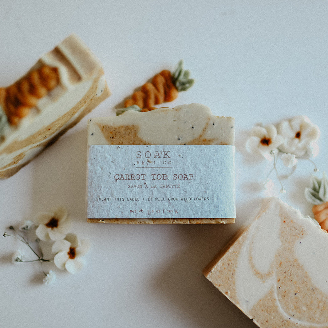 Carrot cake soap bars with decorative elements on a light background