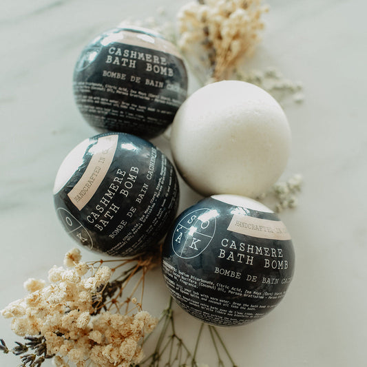 Cashmere bath bombs with dried flowers on a light background